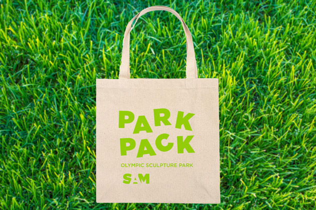 Image of a tote bag that says Park Pack with green grass in the background